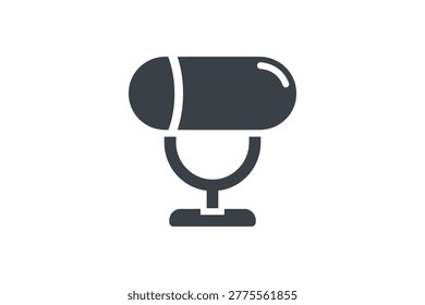 Dark gray flat of a horizontal capsule-shaped microphone on a stand