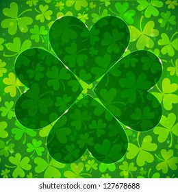 Dark green four-leaf clover shape on light clovers background