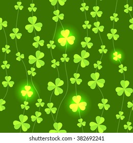 Dark green seamless pattern of shamrock leaves. Abstract shiny garland of leaves. Magic seamless background for St. Patrick's Day. Vector EPS 10
