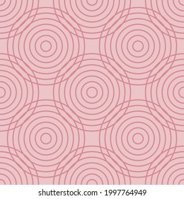 Dark pink circles on light pink background. Seamless backdrop.