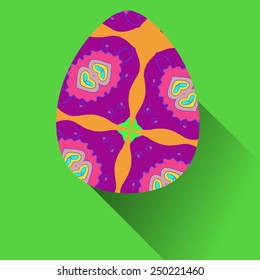 Dark pink Easter egg with floral ornaments on a  green  background. Hand drawn. 