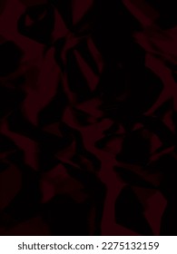 dark red crumpled and wrinkled paper parchment. A crumpled sheet of red paper abstract background.