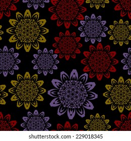 Dark seamless background with geometric stars in yellow, purple and red