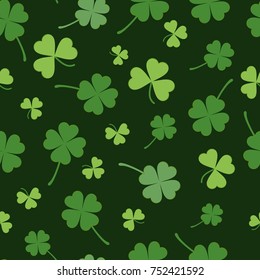 Dark seamless pattern with green clovers. Vector illustration. EPS 10. Green clovers in simple cartoon style.