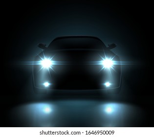 Dark silhouette of car with headlights