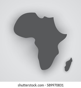 The dark silhouette of the continent of Africa and the island of Madagascar with the shadows on a light gray background