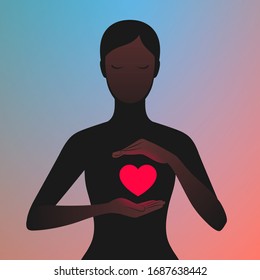 Dark silhouette of woman carefully holding hands near her glowing red heart. Woman in love. Concept of relationship and enamored person