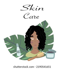 Dark skin girl with skin care set cosmetics bottles scrub cream and oil and leaves
