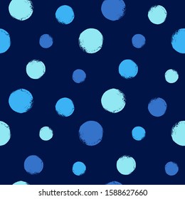 Dark, sky blue brush hand drawn circles, big polka dots, spots seamless vector background. Colorful geometric painted pattern. Abstract chaotic texture, uneven round shapes with textured rough edges.
