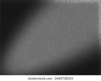 a dark, textured surface, resembling fine-grained metal background. A subtle, soft light emanates from the upper right, casting a gradual shadow towards the lower left.