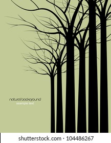dark trees without leaves on green background