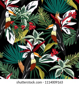 Dark Tropical forest  Colorful Toucan, exotic birds, tropical flowers, palm leaves, jungle leaf, wild flower seamless vector floral pattern background on black 