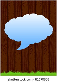 Dark wood background with green grass and blue for inscription cloud