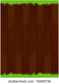 The dark wood background with green grass on the top and bottom