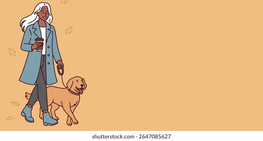 Dark-skinned elderly woman with white hair walks dog with coffee in hand in autumn park enjoying peaceful seasonal walk, banner, copy space