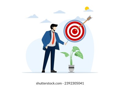 Dartboard inside a magnifying glass for business goal target. The red arrow hits the center of the dartboard. Business success, investment goals, challenges opportunities, goal strategies.
