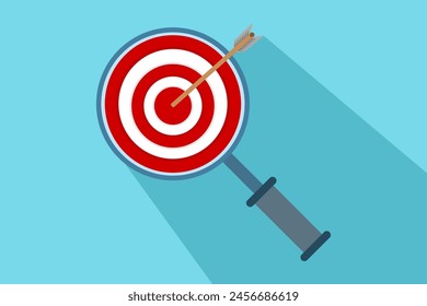 Dartboard inside a magnifying glass for business purposes. The red arrow hits the center of the dartboard. Business success, investment goals, challenges opportunities, goal strategies.