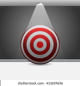 Dartboard or target Illuminated by spotlight in room 