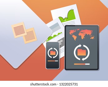 data transfer cloud computer connection database synchronize concept top angle view desktop tablet smartphone financial analysis office stuff horizontal
