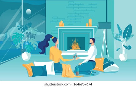 Date Alone With Wine At Home By Fireplace, Flat. Young Couple Sitting On Floor With Pillows Laid Out And Drinking Wine. They Spend Time Together And Watches Cozy Fire Roar. Outside Window Full Moon.