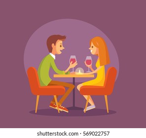 Dating. Valentines day celebration. Sweet happy young couple having romantic dinner with glasses of red wine on date.Drink wine.Christmas evening celebration.Pair couple together at  the dinner table.