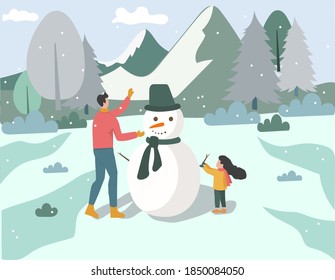 Daughter and dad make snow dolls in winter