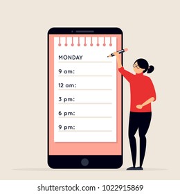 Day Planning And Scheduling Concept. Young Woman With Pencil Standing Next To Big Smartphone With Calendar On Its Screen. Girl Making Notes In Planner App. Time Organizer