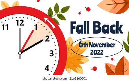 Daylight Saving Time Ends November 6, 2022. Alarm Clock Set To Clock Back One Hour on Background Autumn Foliage. WinterTime, Fall Back.