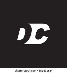 DC negative space letter logo black background