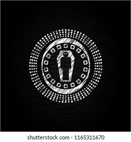 dead man in his coffin icon inside chalk emblem written on a blackboard