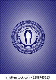 dead man in his coffin icon inside badge with denim texture