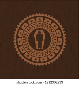dead man in his coffin icon inside wooden emblem. Vintage.