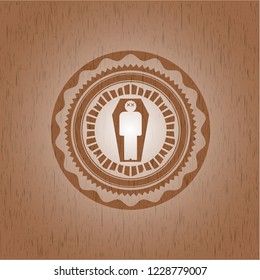 dead man in his coffin icon inside realistic wood emblem