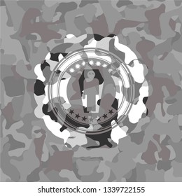 dead man in his coffin icon inside grey camouflaged emblem