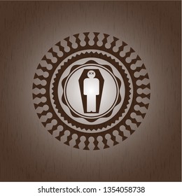 dead man in his coffin icon inside wood emblem