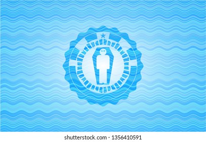 dead man in his coffin icon inside light blue water wave badge background.