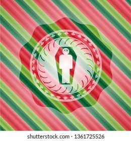 dead man in his coffin icon inside christmas colors emblem.