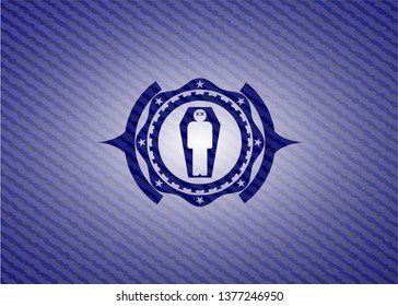dead man in his coffin icon inside badge with denim texture