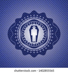 dead man in his coffin icon inside emblem with denim texture