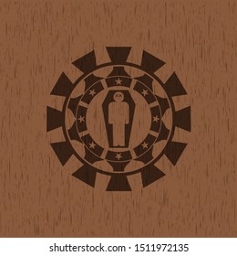 dead man in his coffin icon inside realistic wood emblem