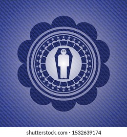 dead man in his coffin icon inside badge with denim background