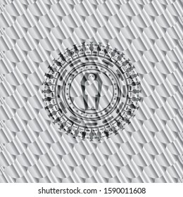 dead man in his coffin icon inside shiny silver badge. Scales pattern. Vector Illustration. Detailed.