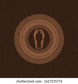 dead man in his coffin icon inside wood emblem. Retro