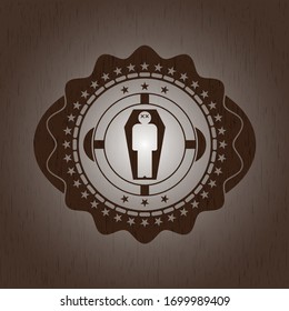 hombre muerto en su ícono de ataúd dentro del emblema de madera. Vintage.