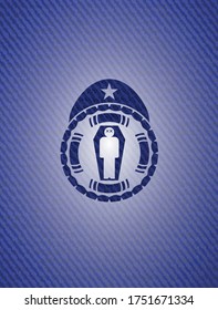 dead man in his coffin icon inside badge with denim texture. 