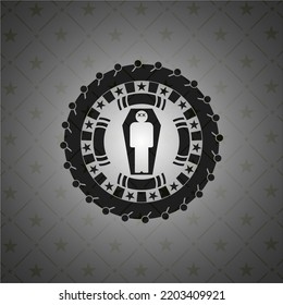 dead man in his coffin icon inside black badge. 
