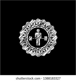 deadlift icon inside chalkboard emblem written on a blackboard