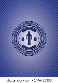 deadlift icon inside emblem with jean background