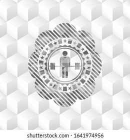 deadlift icon inside grey emblem with geometric cube white background