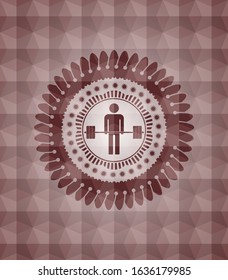 deadlift icon inside red seamless emblem or badge with geometric pattern background.